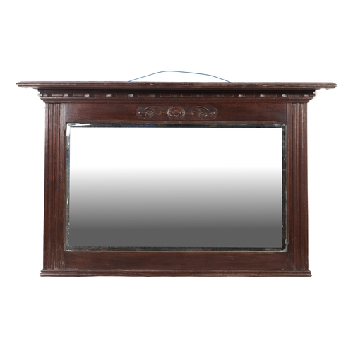 900 - A late Victorian carved oak overmantle mirror with bevel edged rectangular plate, 122cms wide.