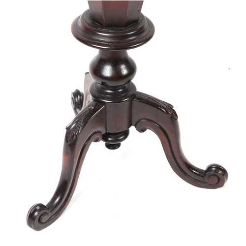 897 - A Victorian walnut trumpet sewing or work table, the octagonal top opening to reveal a fitted interi... 