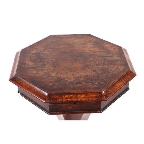 897 - A Victorian walnut trumpet sewing or work table, the octagonal top opening to reveal a fitted interi... 