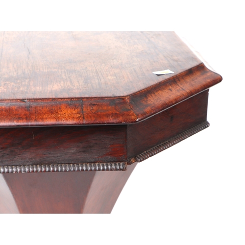 897 - A Victorian walnut trumpet sewing or work table, the octagonal top opening to reveal a fitted interi... 