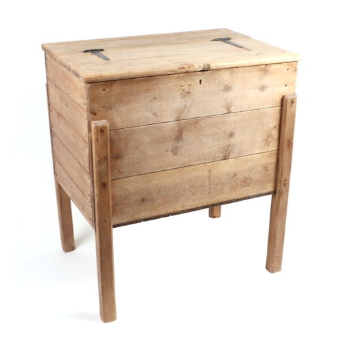 906 - A French pine flour bin with hinged lid and stile feet, 77cms wide.