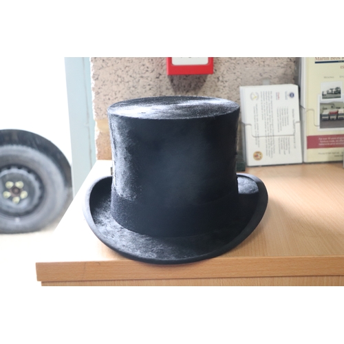 435 - A Dunn & Co. London moleskin top hat, approx 58.5cms diameter, in original cardboard box.