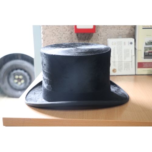 435 - A Dunn & Co. London moleskin top hat, approx 58.5cms diameter, in original cardboard box.