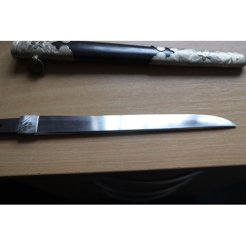 70 - A WWII Japanese Admirals short sword with gilt metal mounts, wirebound shagreen handle, steel blade ... 