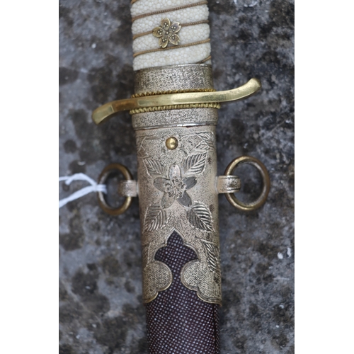 70 - A WWII Japanese Admirals short sword with gilt metal mounts, wirebound shagreen handle, steel blade ... 