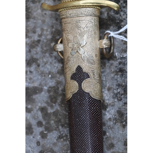 70 - A WWII Japanese Admirals short sword with gilt metal mounts, wirebound shagreen handle, steel blade ... 