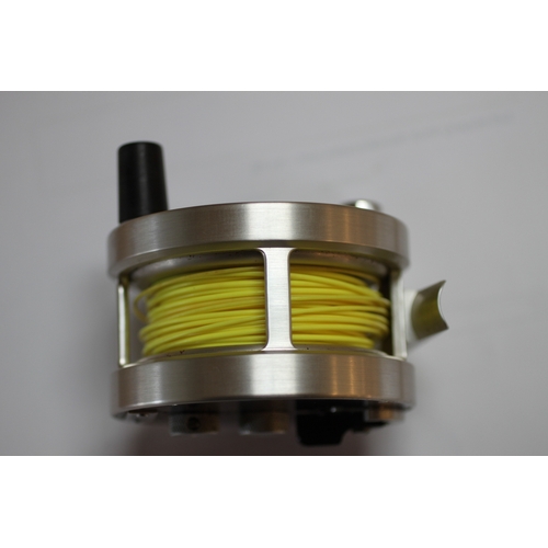 335 - A group of fly fishing wheels to include a JW Young & Sons Masterline DT10SF; a Gladding Intrepid; a... 