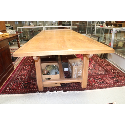 846 - A large oak refectory table, the rectangular top inset with two extra leaves, on chamfered square le... 