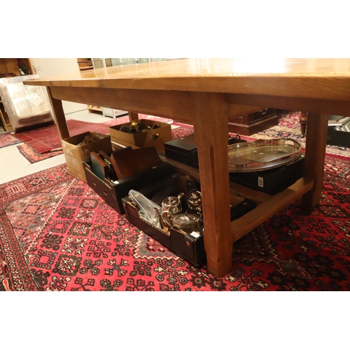 846 - A large oak refectory table, the rectangular top inset with two extra leaves, on chamfered square le... 