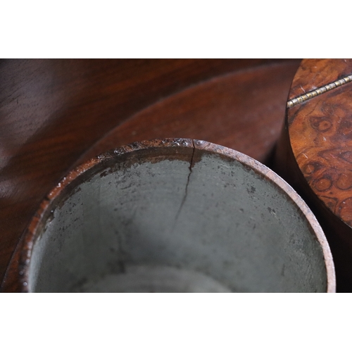 814 - A Victorian burr walnut teapoy, the circular top enclosing a fitted interior, on barleytwist column ... 