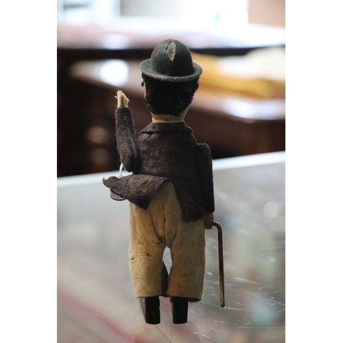 360 - An early 20th century Schuco clockwork model of Charlie Chaplin with fabric covered clothes, approx ... 