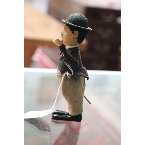 360 - An early 20th century Schuco clockwork model of Charlie Chaplin with fabric covered clothes, approx ... 