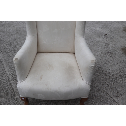 847 - A pair of George III style wingback upholstered armchairs on cabriole front legs (2).