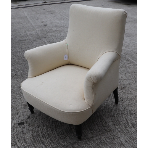 848 - A pair of Victorian upholstered armchairs on ebonised turned front legs (2).