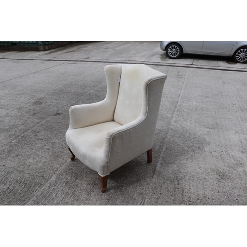 848 - A pair of Victorian upholstered armchairs on ebonised turned front legs (2).