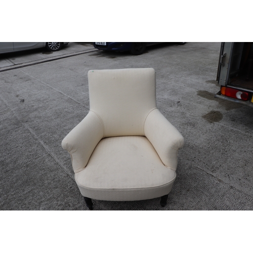 848 - A pair of Victorian upholstered armchairs on ebonised turned front legs (2).