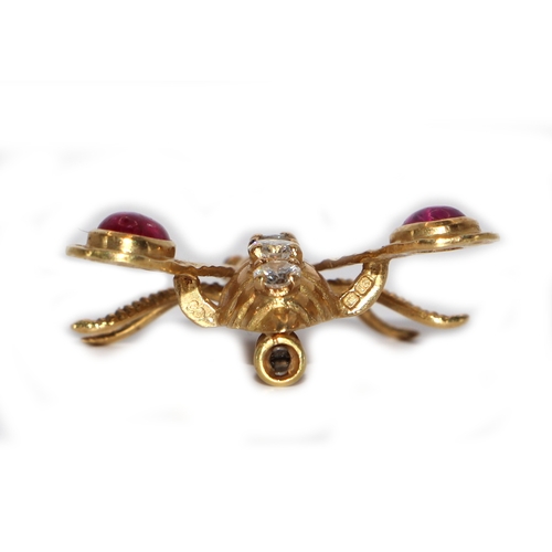 562 - An 18ct gold bee brooch by Chaumet (France), circa 1970, the body set with four diamonds, the wings ... 