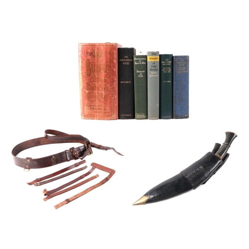 14 - A quantity of assorted militaria to include a WWI brown leather Sam Browne; a kukri with horn handle... 