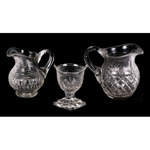 218 - A pair of Victorian glass decanters; together with other decanters; cut glass jugs and other items.