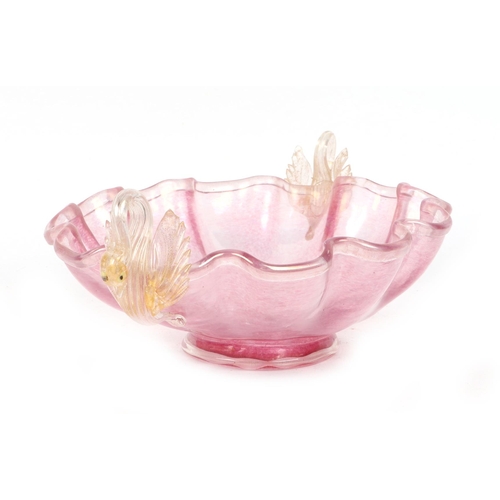 221 - A Venetian pink glass bowl with twin swan handles, 35cms wide; together with a similar red glass dis... 