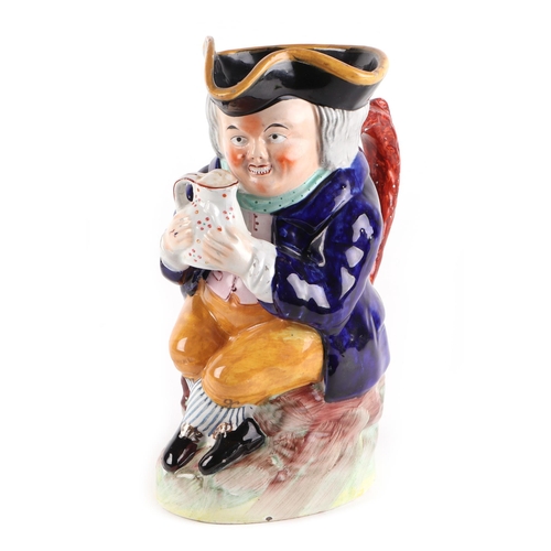 223 - A 19th century Staffordshire pottery character jug, 23cms high.