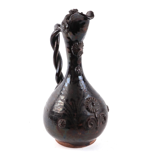 230 - A Cantagalli style glazed pottery ewer, 35cms high.