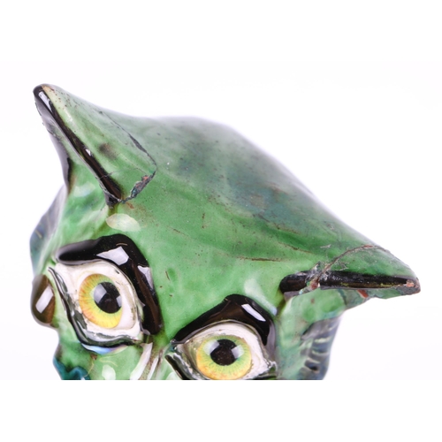 243 - A C H Brannam Art pottery cat with glass eyes, 33cms high (a/f).