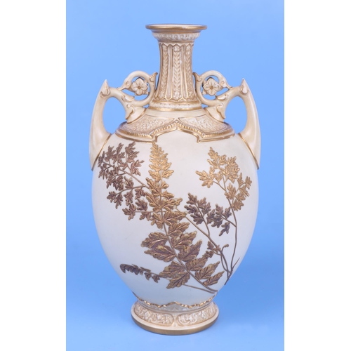 246 - A Royal Worcester blush ivory twin-handled baluster vase, model no. 1200, decorated in relief with g... 