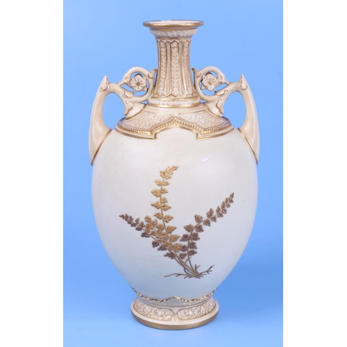 246 - A Royal Worcester blush ivory twin-handled baluster vase, model no. 1200, decorated in relief with g... 