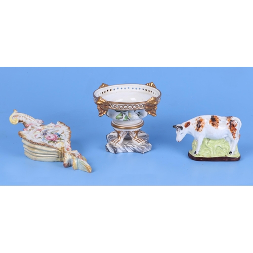 249 - A continental pottery wall pocket; together with a Victorian teapot and cover; a bisque half doll; a... 