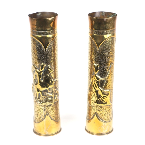 25 - A pair of brass trench art shell case vases, 35cms high (2).