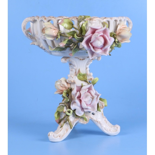 251 - A Meissen style oil lamp base (converted to a table lamp) decorated in relief with roses and having ... 