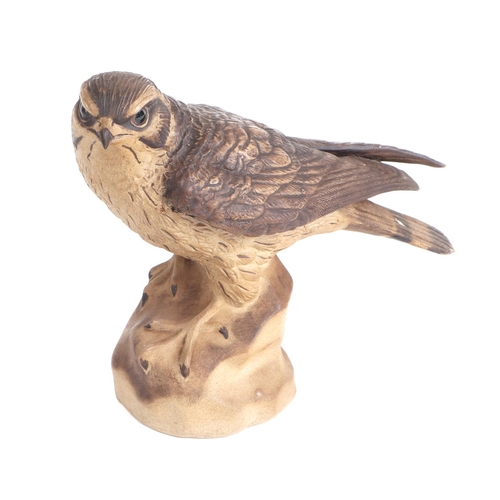 255 - A Poole Pottery stoneware Kestrel / Merlin bird of prey figure, impressed signature to base 'B Linle... 