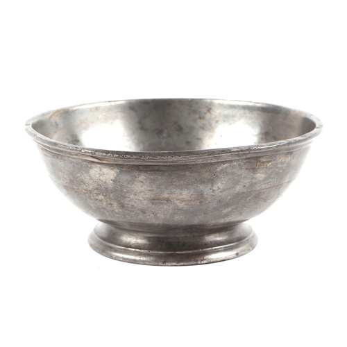 28 - A pewter footed bowl stamped HMS Eden with crowfoot to the underside. 13.5cm diameter