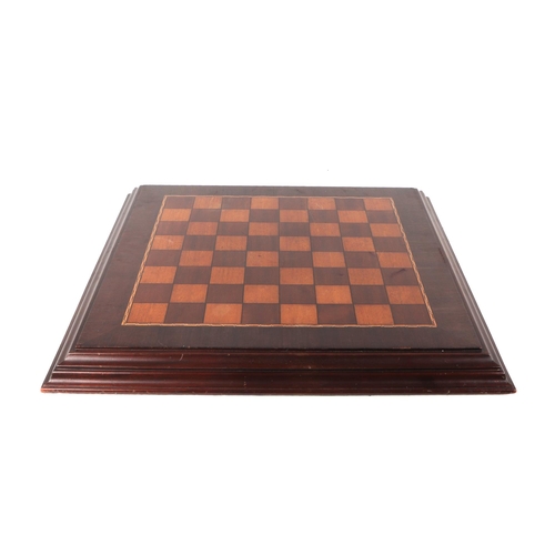 282 - An inlaid mahogany table top chess board, overall 64 by 64cms.