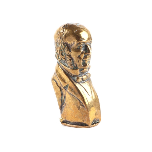 307 - A novelty brass vesta case in the form of Gladstone, 5.5cms high.