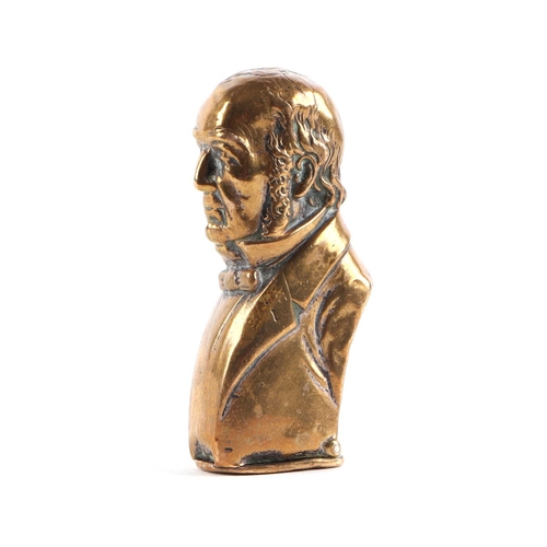 307 - A novelty brass vesta case in the form of Gladstone, 5.5cms high.