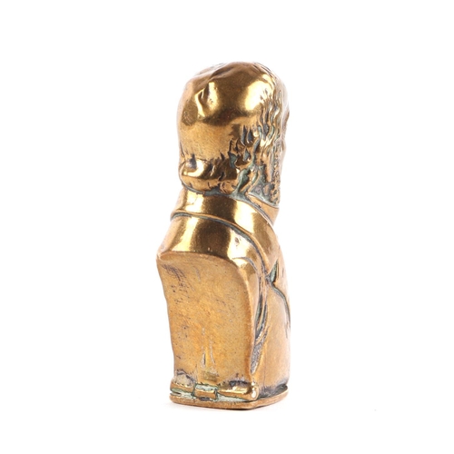 307 - A novelty brass vesta case in the form of Gladstone, 5.5cms high.