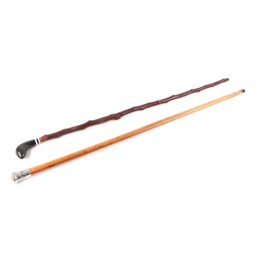 313 - A silver topped Malacca walking cane, London 1980; together with a horn handled walking stick and a ... 