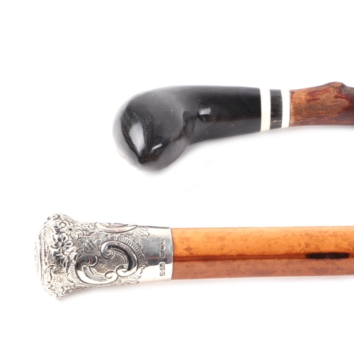 313 - A silver topped Malacca walking cane, London 1980; together with a horn handled walking stick and a ... 