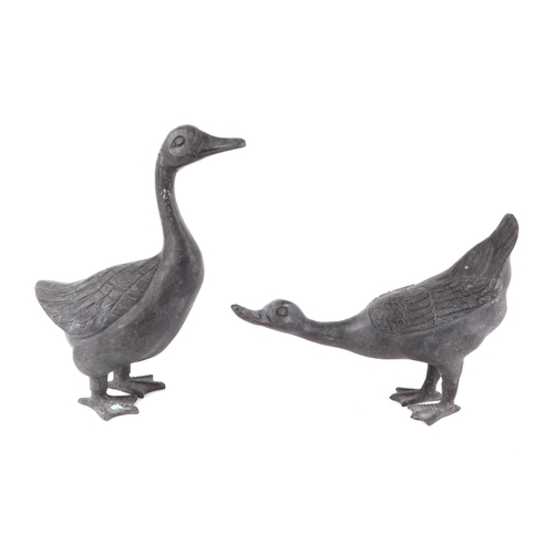 315 - A pair of cast metal geese, the largest 28cms high (2).