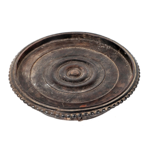 328 - A 19th century turned hardwood wine bottle coaster, 20cms diameter.