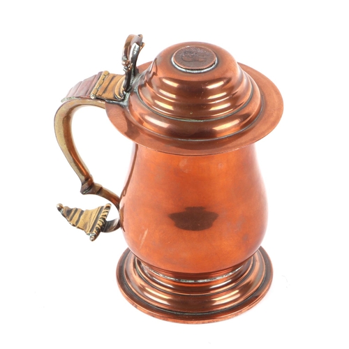 329 - A George III copper lidded tankard, the top with inset coin dated 1806, 18cms high.