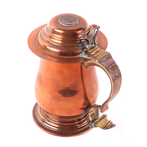 329 - A George III copper lidded tankard, the top with inset coin dated 1806, 18cms high.