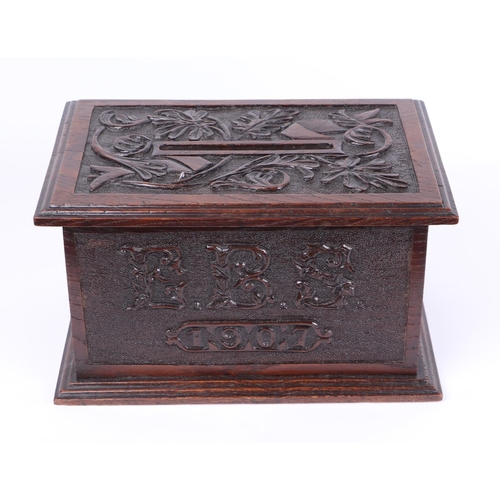 344 - An early 20th century carved oak country house letters box, initialled 'EBS' and dated 1907, 32cms w... 