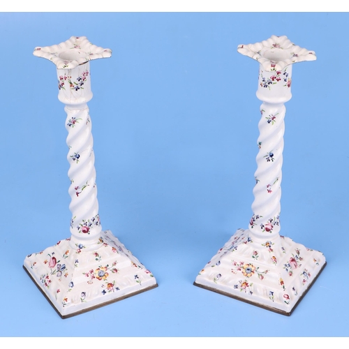 347 - A pair of late 18th century South Staffordshire enamel candlesticks decorated with sprays of flowers... 