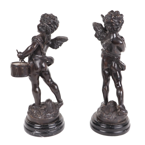 352 - A pair of Grand Tour style bronze cherubs depicting playing a violin and a drum, each mounted on a b... 