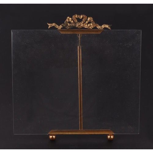 353 - A pair of glass and gilt metal strut photo / menu holders with rectangular bevelled glass backs on g... 