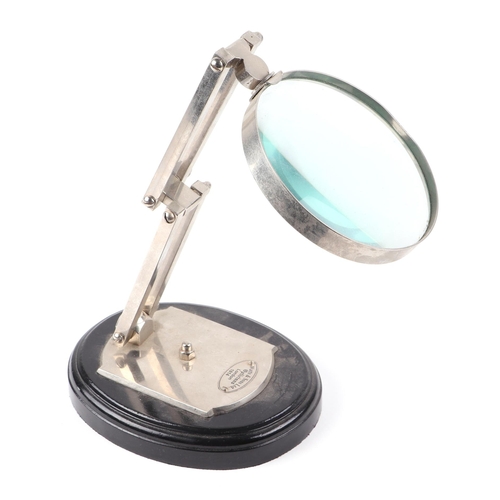 365 - A Watts & Sons Ltd opticians advertising desktop magnifier, 28cms high.