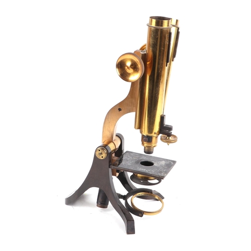 372 - A late Victorian W. F. Stanley London lacquered brass monocular microscope with a selection of lense... 